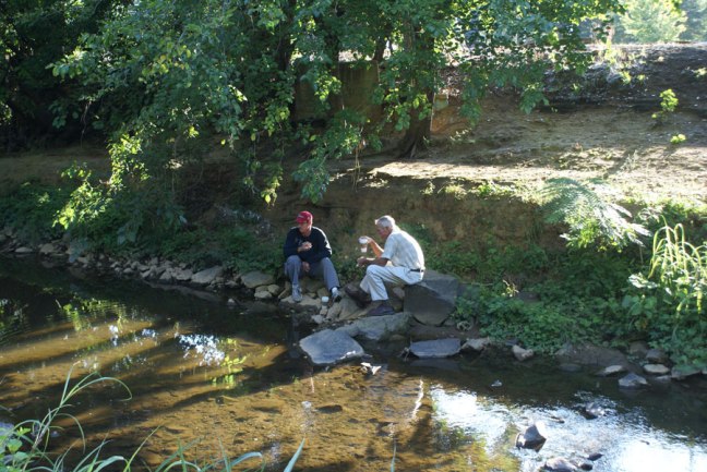 relaxing with coffee next to Little Sugar Creak greenway near Uptown Charlotte