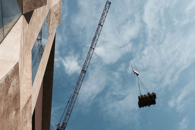 A construction crane at the Mint Residential site in Uptown Charlotte