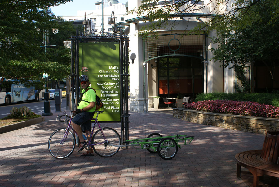 B-cycle green guy shuttles bicycles between stations in Uptown Charlotte