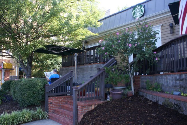 enjoying coffee and a newspaper