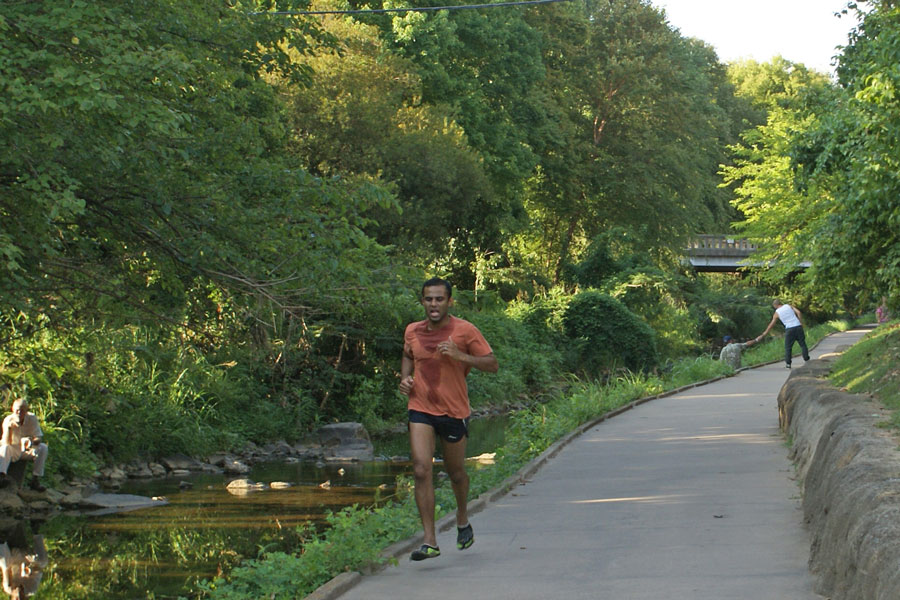 Jogger on the Little Sugar Creek greeway near Uptown Charlotte.