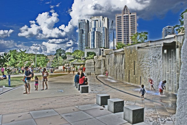 Playing in the water wall at Romare Bearden Park in Uptown Charlotte